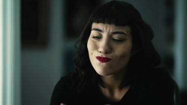 Concerned young woman suffering feeling frustrated closeup face portrait. One pensive hispanic girl