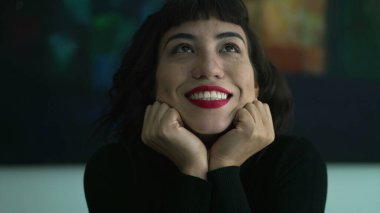 Elated young woman feeling joyous. Portrait of one hispanic latin girl in GLEE and DELIGHT