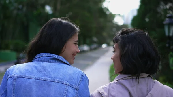 Back Two Young Women Walking Together Two Female Friends Chatting — Foto de Stock