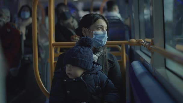 Mother Riding Bus Baby Infant Lap Covid Face Mask — Videoclip de stoc