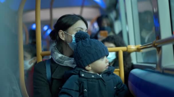 Mother Toddler Baby Riding Bus Wearing Covid Face Mask — Stockvideo