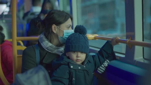 Mother Baby Toddler Riding Bus Wearing Surgical Face Mask — Stockvideo