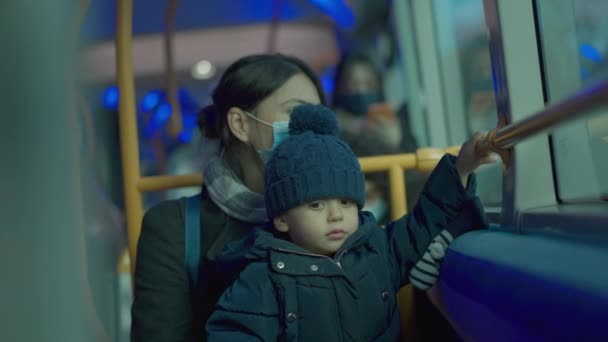 Mother Baby Toddler Riding Bus Wearing Surgical Face Mask — Stockvideo