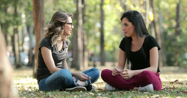 Candid Friends Seated Park Talking Each Other Girlfriends Speaking Conversation — Stok fotoğraf