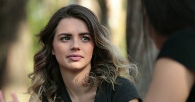 Candid friend listening to conversation outside at the park