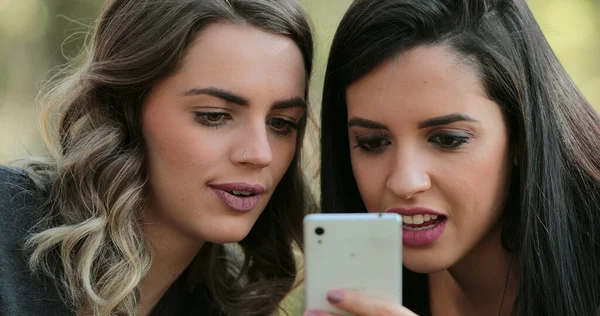 Authentic Friends Together Outdoors Checking Cellphone — Fotografia de Stock