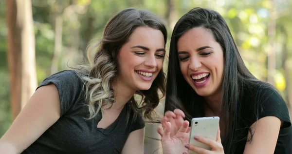 Authentic Friends Together Outdoors Checking Cellphone Girls Looking Holding Smartphone — Fotografia de Stock