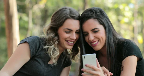 Authentic Friends Together Outdoors Checking Cellphone Girls Looking Holding Smartphone —  Fotos de Stock