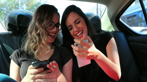 Friends Real Life Laugh Back Seat Car Holding Cellphone Showing — Photo