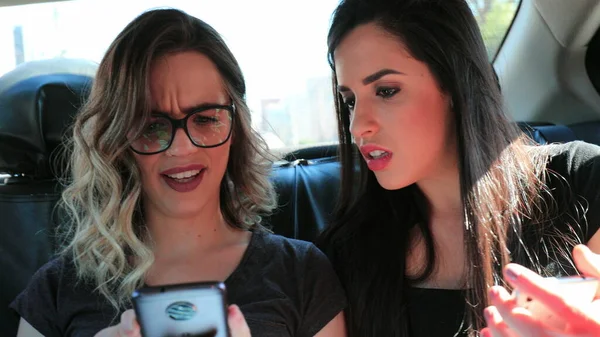 Friends Concerned What Seeing Cellphone Screen Girlfriends Back Seat Car — 스톡 사진