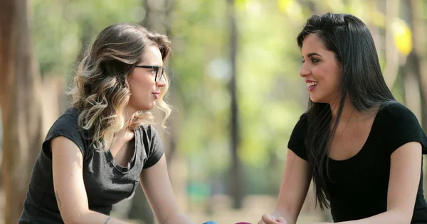 Candid Friends Seated Park Talking Each Other Girlfriends Speaking Conversation — ストック写真