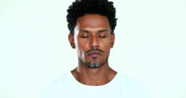 African American practicing mindfullness eyes closed in meditation