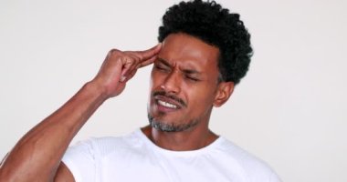 African man having a headache pain and worry