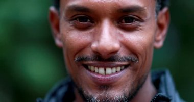 Portrait of friendly mixed race man portrait smiling to camera. Mixed race smiling person of african descent