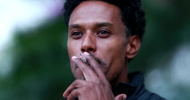 Mixed Race African Descent Man Smoking Cigarette — стоковое видео