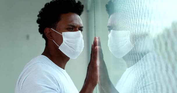 Black Man Lockdown Wearing Covid Mask Looking Out Apartment Window — Wideo stockowe