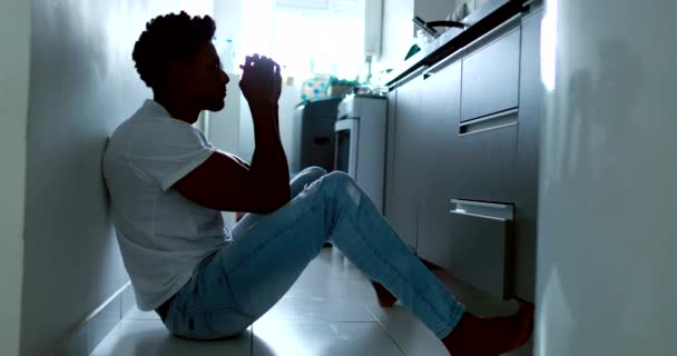Worried Black Man Sitting Kitchen Floor Hands Head — Wideo stockowe