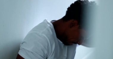 Black man thinking about problems, feeling stressed