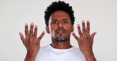 African man shock emotional reaction, upset angry black person, are you crazy puzzled
