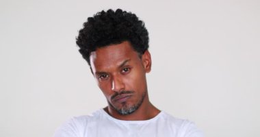 Judgemental person looking to camera feeling superior. African man portrait feeling annoyed