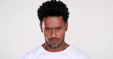 Angry black African person feeling pissed off looking to camera