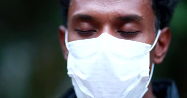 Portrait black African man wearing surgical face mask prevention against outbreak pandemic