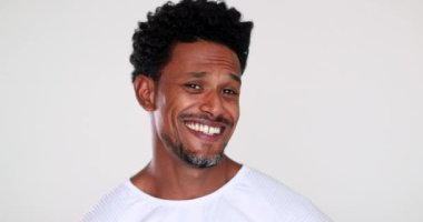 Casual American man feeling relaxed smiling, real life laugh and smile