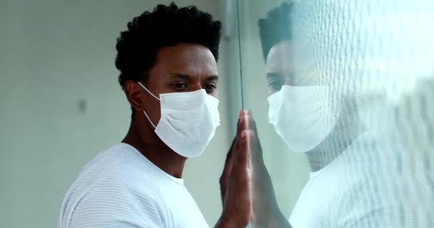 African Man Holding Window Hands Quarantine Lockdown Wearing Virus Mask — 비디오
