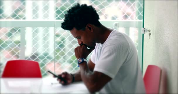 Pensive African Man Looking Smartphone Device Home Thoughtful Black Person — Wideo stockowe