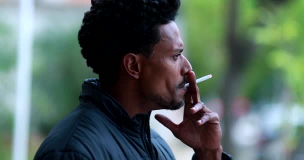 Pensive Black African Man Smoking Cigarette Outdoors — Video Stock