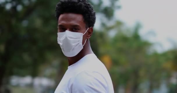 African American Standing Looking Camera Wearing Covid Surgical Mask Pandemic — Video Stock