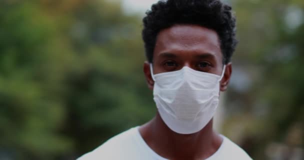 African American Standing Looking Camera Wearing Covid Surgical Mask Pandemic — Video Stock