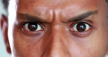 Man has a serious look on his face. Closeup of man frowning and with an angry face, unbelief reaction