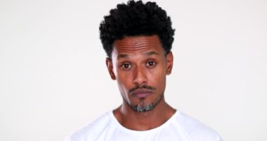 African man changing moods from surprised to relief smiling
