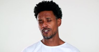 Pensive African american man thinking, expressive face. Thoughtful black guy reaction agreeing