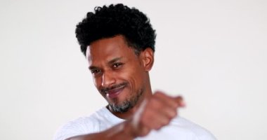 Portrait person celebrating success with fist. smiling african man feeling happy