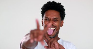 Happy African black man reacting to good news, person celebrating portrait face