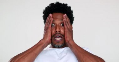 Man reaction with horror and terror looking to camera emotional fright portrait