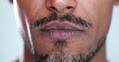 Person pressing lips close-up, man face mouth, lips pressed, facial expression thinking with face