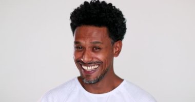 Black man charismatic smile looking to camera in agreement listening