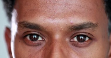 Closeup mixed race man eyes close-up paying attention, listening attentively concept