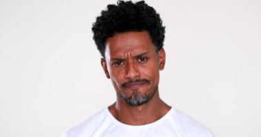 Doubtful anxious black African man portrait