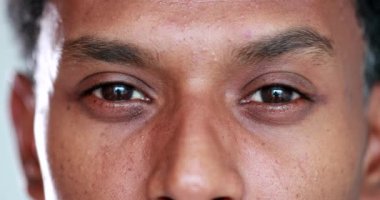 Man of african descent staring to camera macro close-up