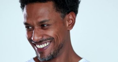Black guy portrait smiling and laughing, authentic real life smile african person
