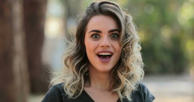 Woman looking to camera with a surprise shock look expression reaction