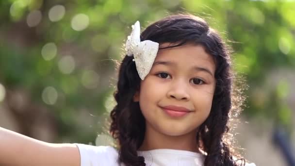 Mix Race Child Smiling Camera Portrait Close Face Park — Vídeo de Stock