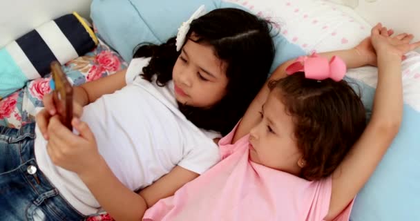 Two Children Watching Video Smartphone Device Home — Vídeos de Stock