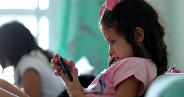 Little Girl Using Smartphone Home Child Kid Absorbed Screen — Stockvideo