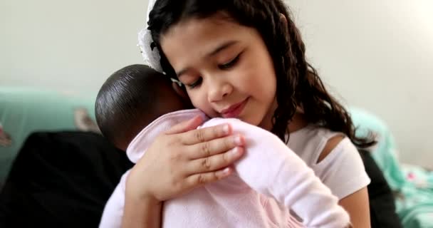 Child Hugging Black Doll Hispanic Little Girl Kid Embracing Baby — Stockvideo