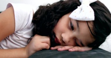 Pensive little girl child thinking, Thoughtful sad kid feeling bored